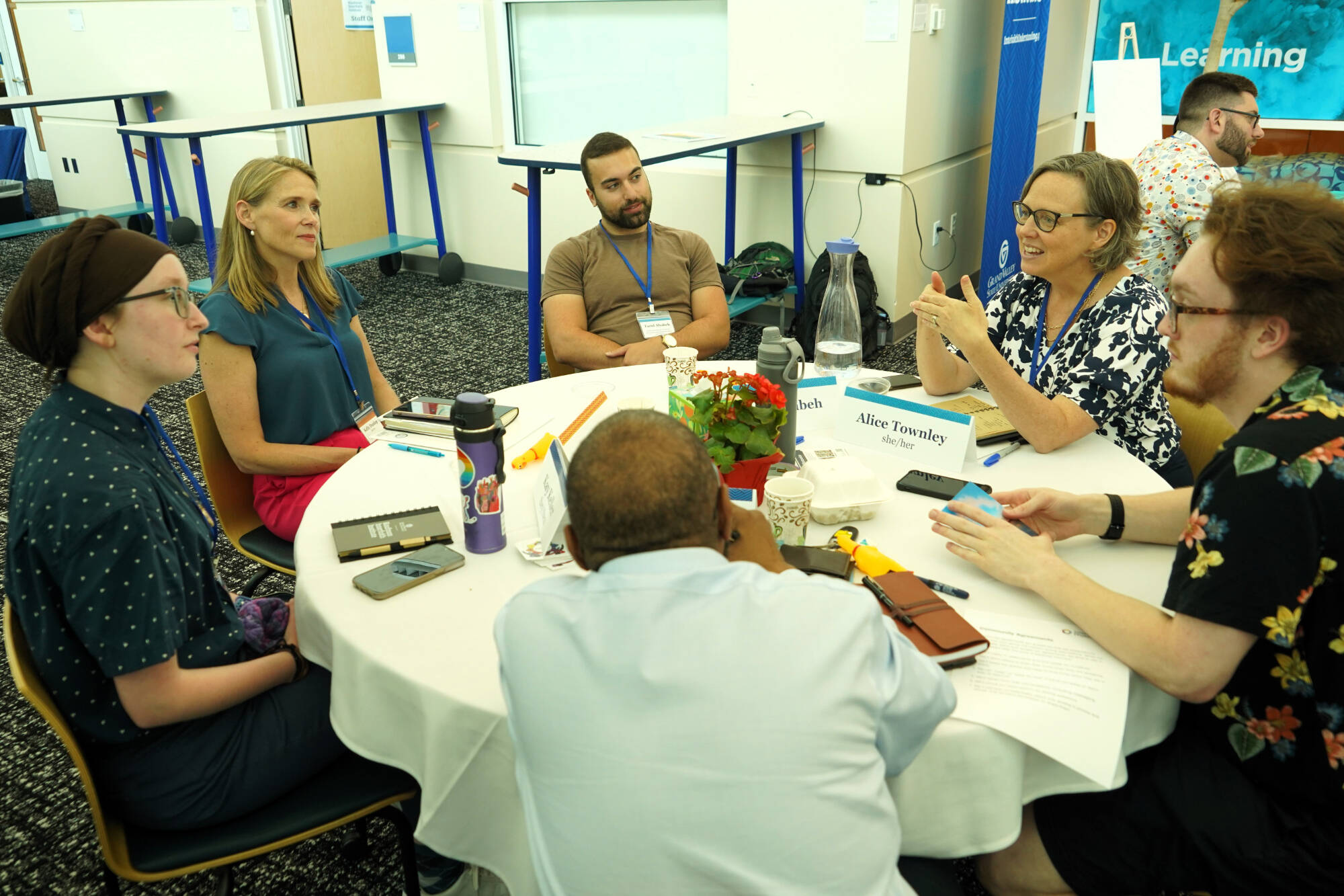 Community members interact at a Kaufman event